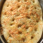 Garlic Herb Focaccia Bread - an easy and flavorful bread that is vegan-friendly. Impress your family or dinner guests with this customizable bread that's better than store-bought.