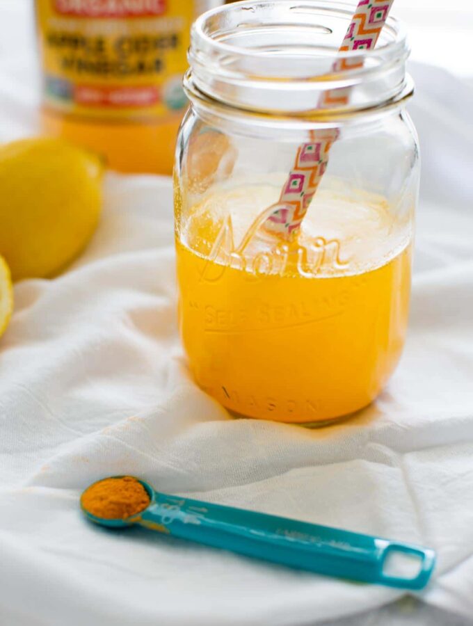 Morning Turmeric Detox Drink with apple cider vinegar, maple syrup and a pinch of cayenne. Lots of health benefits in this elixir to kickstart your day!
