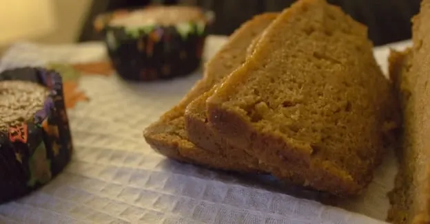 side shot of 3 slices of pumpkin bread