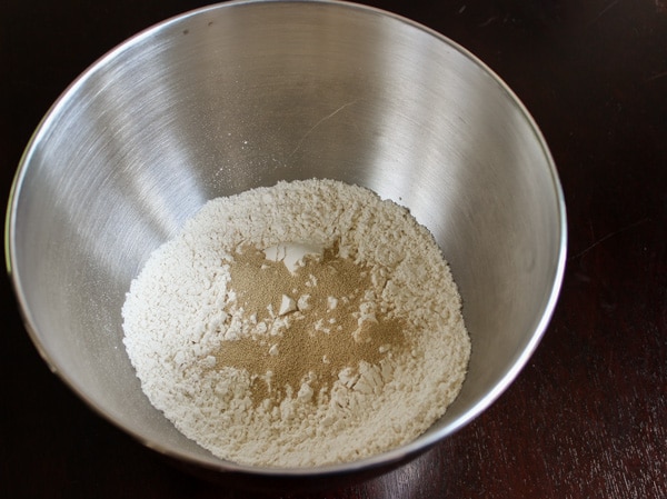 yeast and flour in mixing bowl ready to make rolls