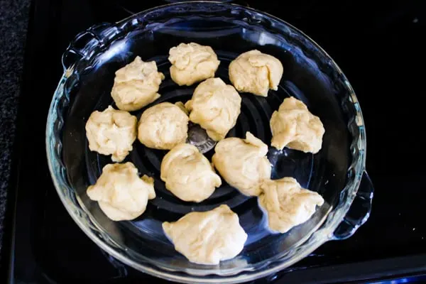 preparing roll dough in baking dish