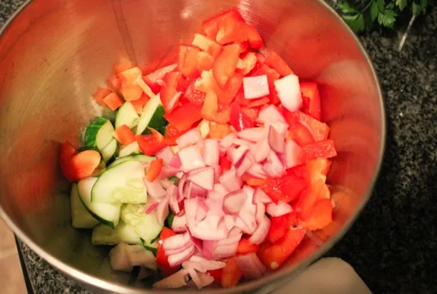 chopped vegetables in bowl for greek quinoa salad