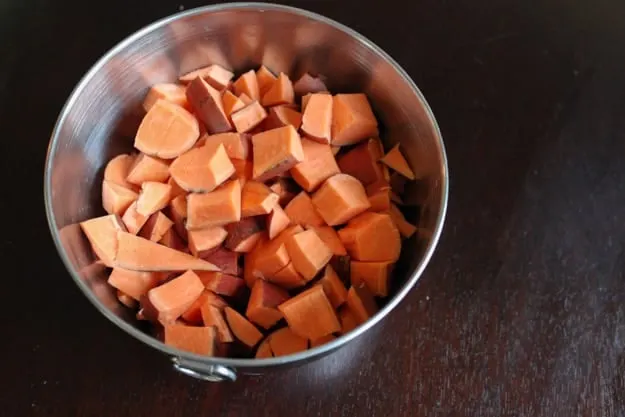 chopped sweet potatoes in mixing bowl