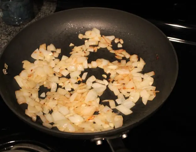 diced onions cooking on stove top