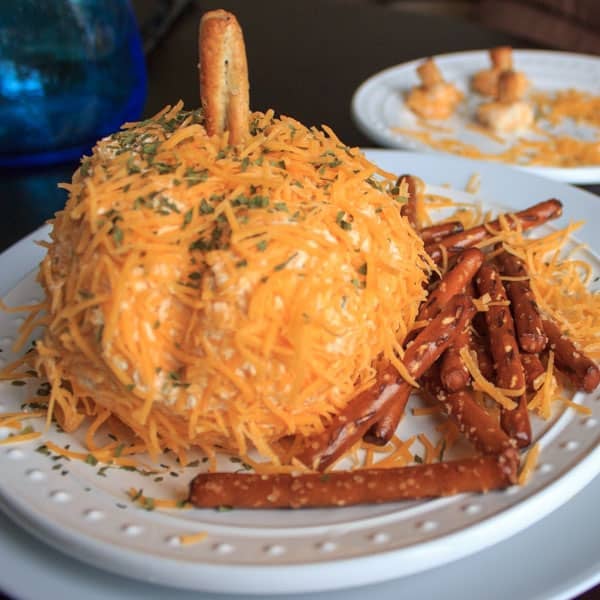 A pumpkin shaped cheese ball that is a perfect appetizer to serve at a Halloween or other Fall-themed event. Super cute and delicious!