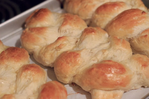 homemade challah bread on baking sheet