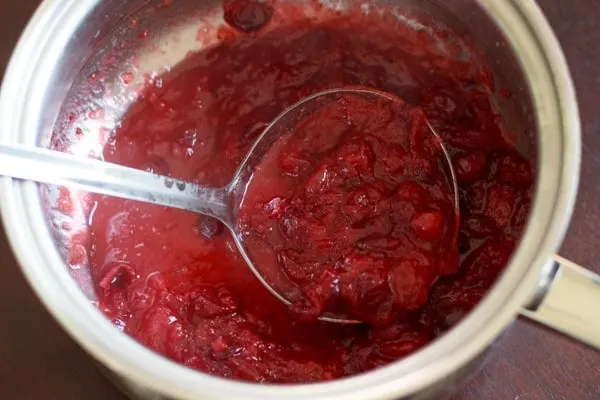 Slightly sweet cranberry sauce flavored with honey and fruit juice. A perfect vegetarian and gluten free side dish for Thanksgiving or holiday dinners. 