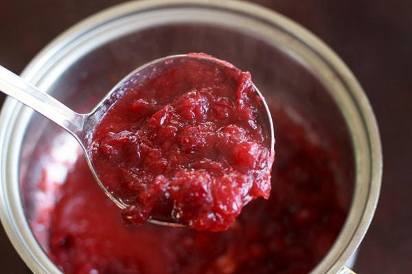 Slightly sweet cranberry sauce flavored with honey and fruit juice. A perfect vegetarian and gluten free side dish for Thanksgiving or holiday dinners. 