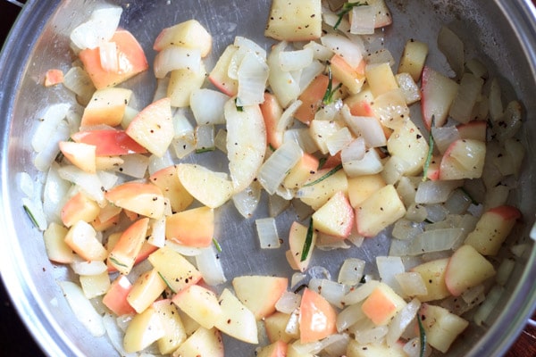 sauteéing onions, apples and herbs for the stuffing in pan