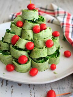 A Christmas tree pita pinwheel appetizer that is an adorable hit for any holiday party. Customizable and easy finger food!