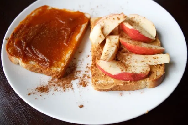 Peanut butter, pumpkin butter, and apple sandwich. A unique, crunchy and flavorful combination for all your autumn cravings.