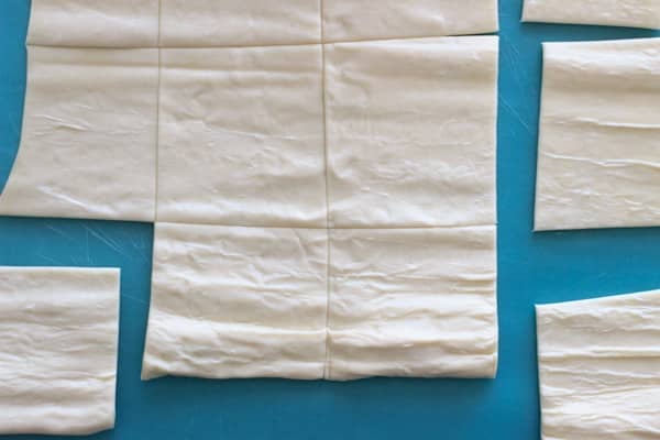 cutting puff pastry dough into squares