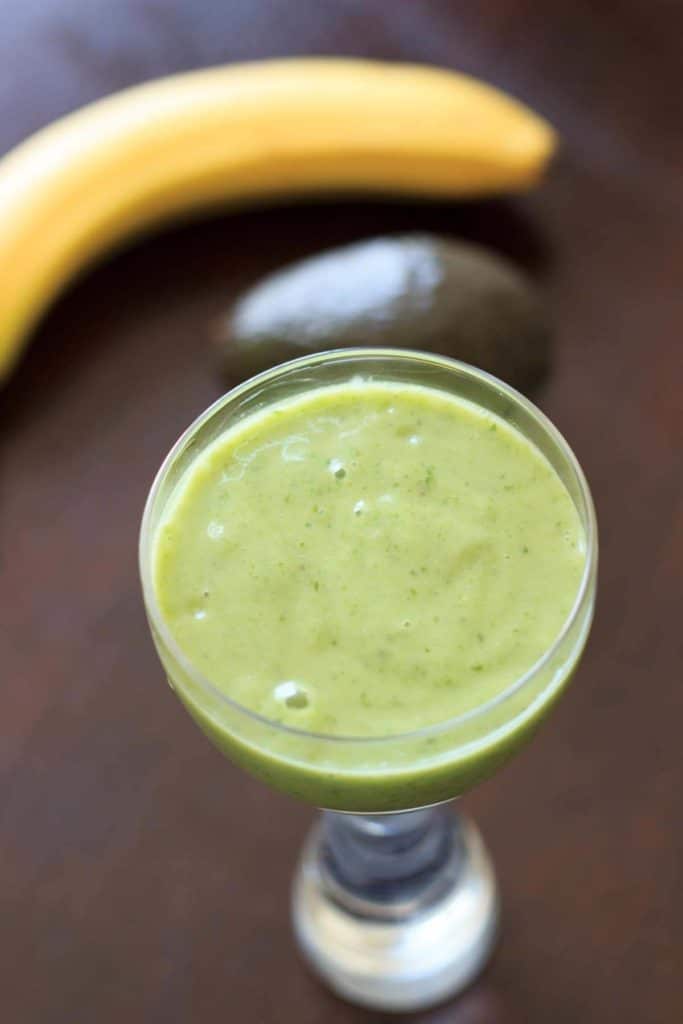 An avocado banana smoothie that is sure to brighten up your day! Creamy, fruity, and deliciously tasty AND good for you. Great way to mix up your typical green smoothie.