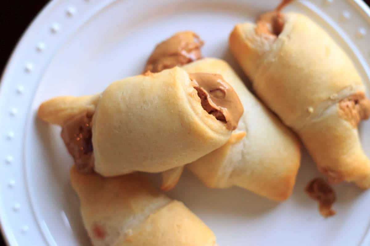 Peanut butter and jelly crescent wraps on white plate