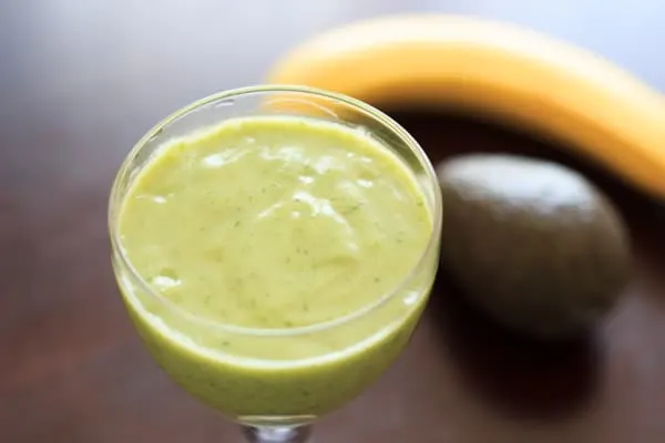 An avocado banana smoothie that is sure to brighten up your day! Creamy, fruity, and oh so good.