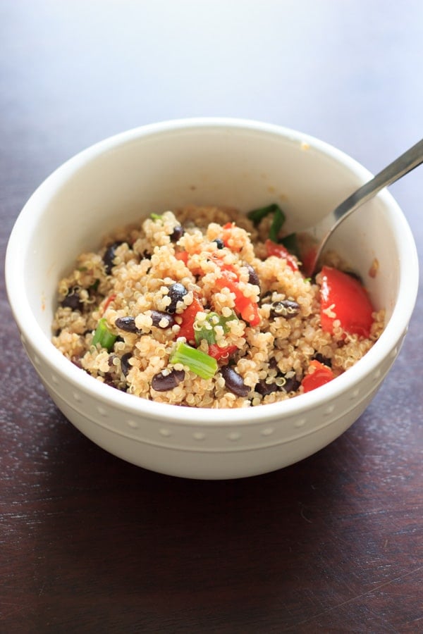 Black bean quinoa salad - flavorful, fast and filling. Another great way to enjoy quinoa in a vegan, gluten-free way. This was a hit for vegetarians and non-vegetarians alike!