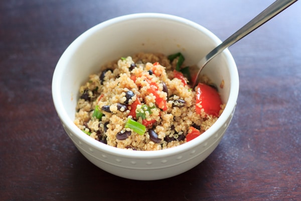 Black bean quinoa salad - flavorful, fast and filling. Another great way to enjoy quinoa in a vegan, gluten-free way. This was a hit for vegetarians and non-vegetarians alike!