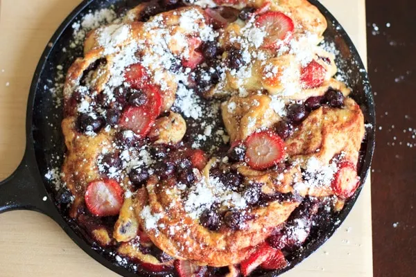 Berries stuffed inside delicious cinnamon swirl bread topped with powdered sugar