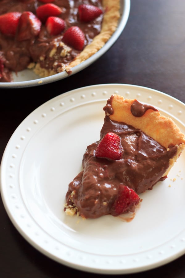 Nutella pudding with a homemade tart crust topped with strawberries. Because fruit + chocolate = healthy dessert!