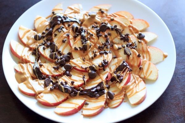 Apple Nachos with peanut butter and chocolate drizzle. Fruit, protein and chocolate makes this a great healthy snack at any time! | trialandeater.com