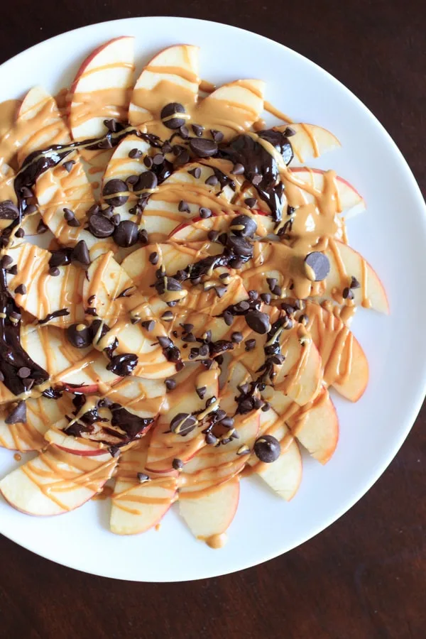 Apple "Nachos" with peanut butter and chocolate drizzle. Fruit, protein and chocolate makes this a great healthy snack at any time! | trialandeater.com