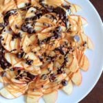 Apple Nachos with peanut butter and chocolate drizzle. Fruit, protein and chocolate makes this a great healthy snack at any time! Vegan, gluten-free, 5 minute dessert.