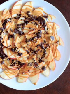 Apple Nachos with peanut butter and chocolate drizzle. Fruit, protein and chocolate makes this a great healthy snack at any time! Vegan, gluten-free, 5 minute dessert.