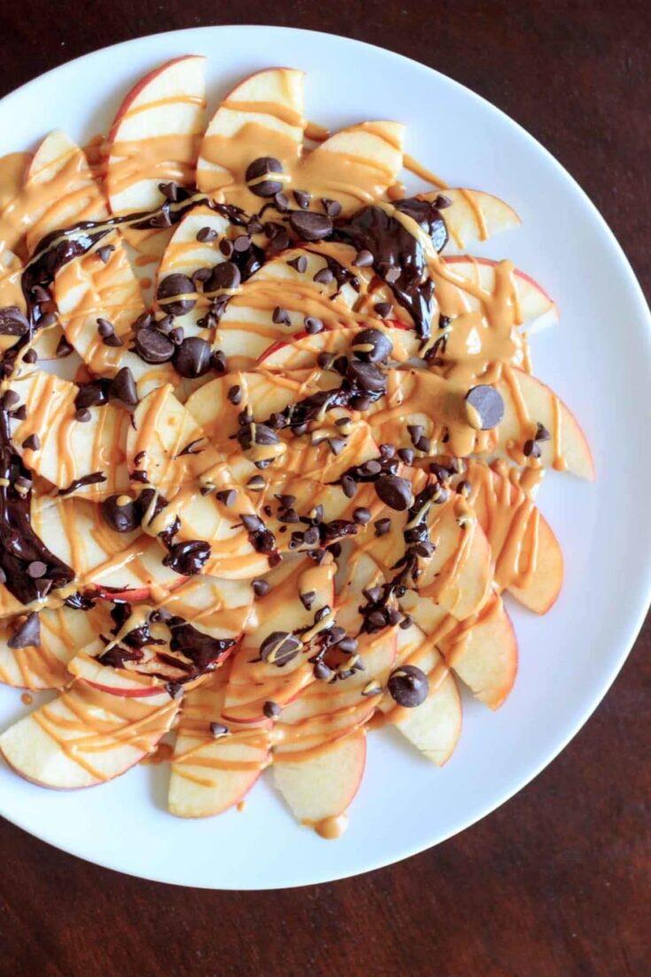 Apple Nachos with peanut butter and chocolate drizzle. Fruit, protein and chocolate makes this a great healthy snack at any time! Vegan, gluten-free, 5 minute dessert.