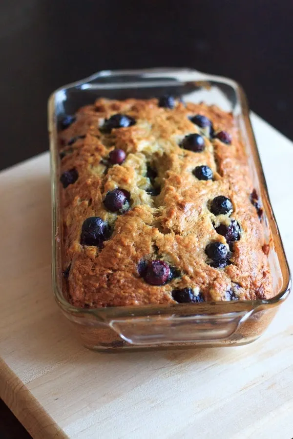 Blueberry banana bread in clear glass bread baking dish