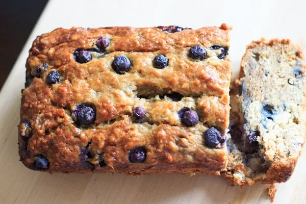 Blueberry banana bread with one slice cut off the end