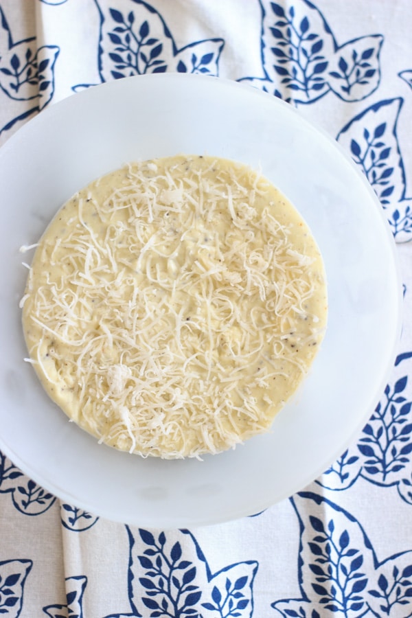 Coconut kiwi ice cream with shredded coconut on top in a bowl