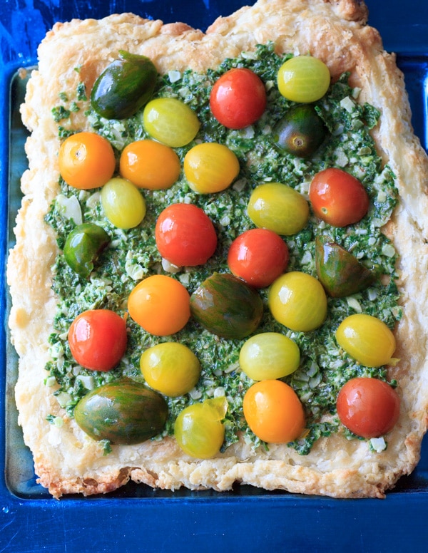 Heirloom tomato tart with homemade puff pastry, vegan pesto, and heirloom tomatoes. Delicious! @trialandeater