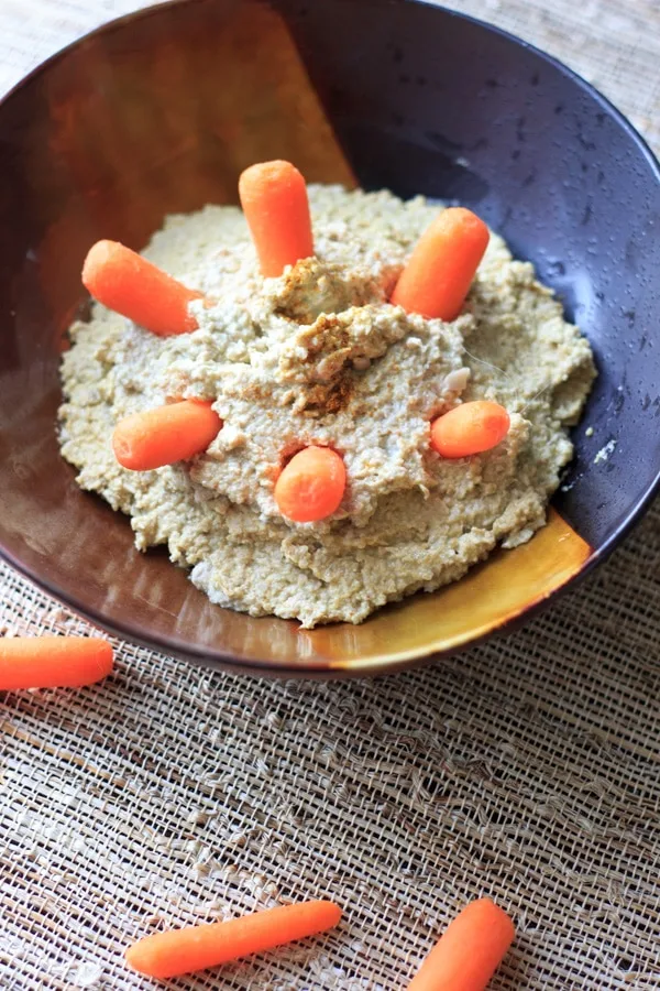 Change out your normal chickpea hummus and make it out of sunflower seeds instead! Curry + cayenne spices give it an extra kick of flavor. | @trialandeater