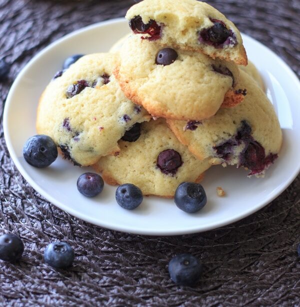 Lemon blueberry cookies piled on white plate