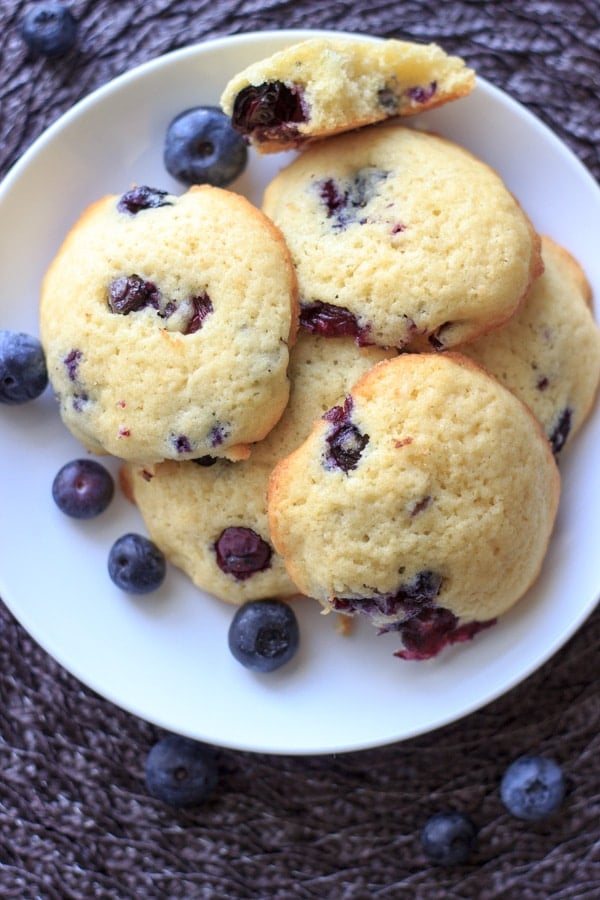 Lemon blueberry cookies piled on white plate