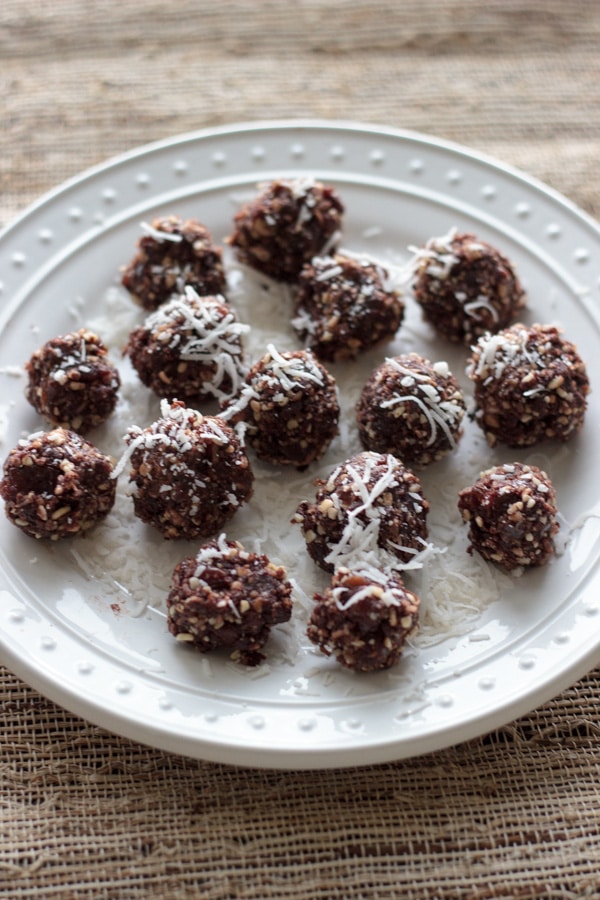 plate of almond joy protein balls on white plate