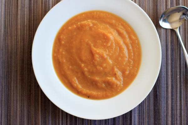 Butternut squash apple soup. Delicious autumn flavors blended together make this vegan soup a crowd-pleasing appetizer.