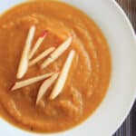 Butternut squash apple soup. Delicious autumn flavors blended together make this vegan soup a crowd-pleasing appetizer.