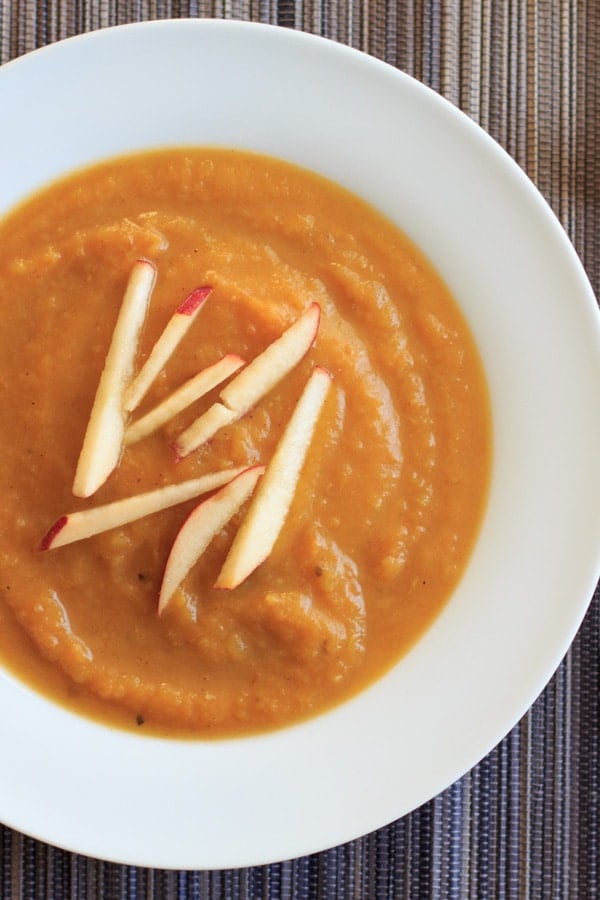 Butternut squash apple soup. Delicious autumn flavors blended together make this vegan soup a crowd-pleasing appetizer.