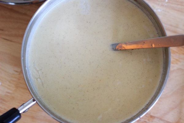 cooking the eggnog in stove pot