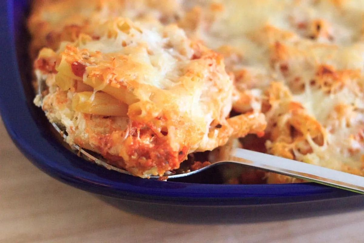 scooping out a serving of grandma's baked ziti