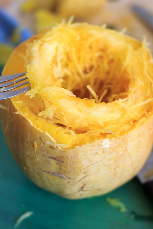 showing a ring of cooked spaghetti squash and how it lifts out of rind