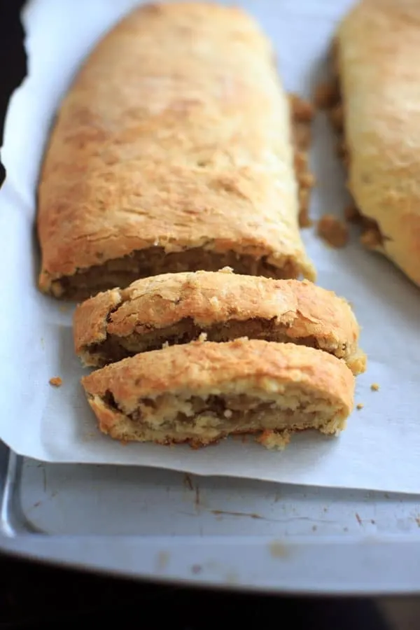 slicing potica roll on baking sheet