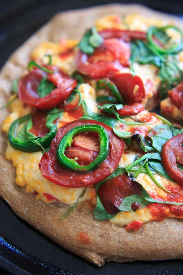 Spicy Pimento Cheese Pizza. If you like spicy, you'll like this pizza! Homemade jalapeno pimento cheese and extra jalapeno + hot sauce toppings make this a spicy food lovers dream.