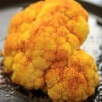 Turmeric Roasted Cauliflower Halves - a unique way to bake cauliflower and a colorful + flavorful side.