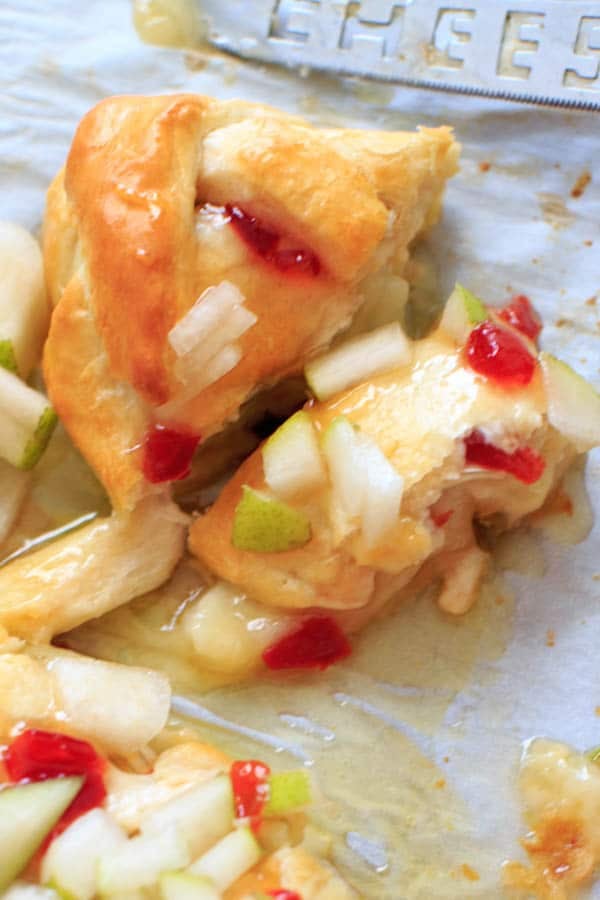 Indulge a little with this Baked Brie cheese with Sweet Hot Pepper Jelly and Pear. Hot and sweet, creamy with a little crunch and a whole lot of deliciousness. Served as an appetizer or dessert, it is sure to be a crowd pleaser.