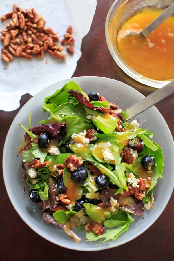 Italian Blue Salad - mixed greens served with blue cheese, honey roasted pecans, fresh blueberries and an apricot vinaigrette dressing.