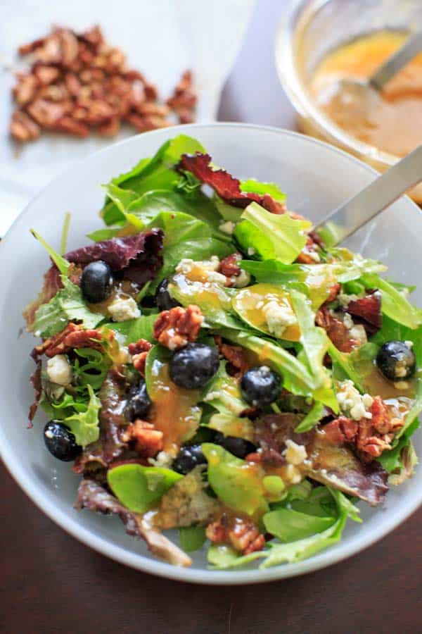 Italian Blue Salad - mixed greens served with blue cheese, honey roasted pecans, fresh blueberries and an apricot vinaigrette dressing.