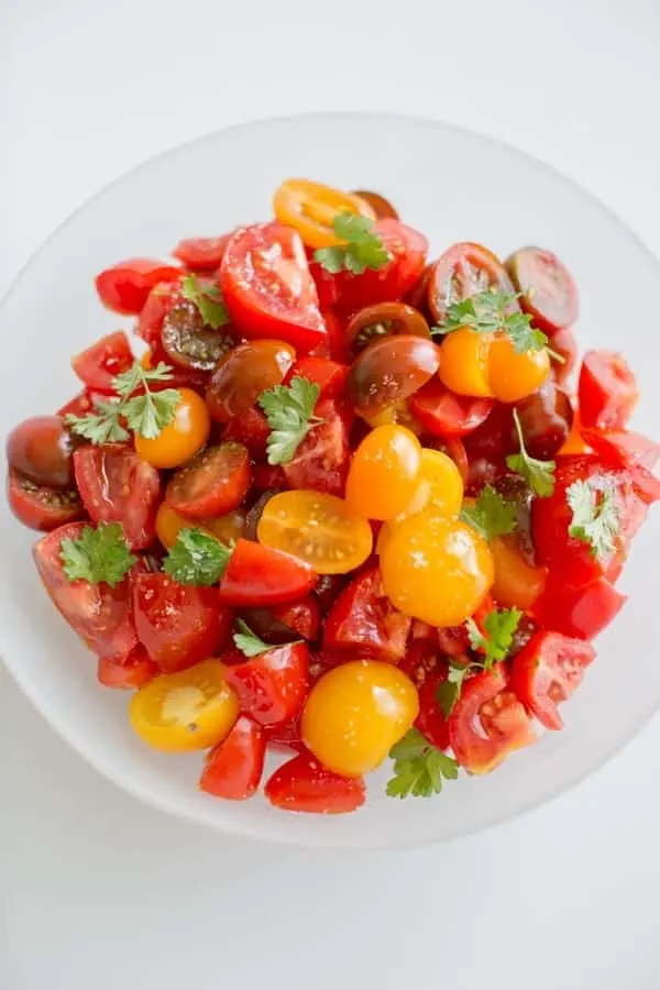 Simple Summer Tomato Salad. Healthy, light, delicious and portable so you can pack it to-go for all your summer adventures.