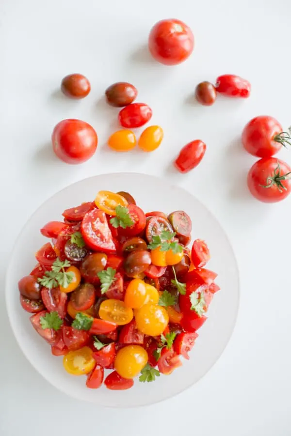 Simple Summer Tomato Salad. Healthy, light, delicious and portable so you can pack it for all your summer adventures.